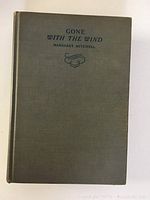 Front cover of the vintage 1938 Gone With The Wind hardcover book, green cloth with printed title and author.