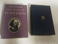 Two vintage hardcover books by Tennyson shown side by side. One with purple dust jacket featuring gold text and illustration, the other blue hardcover with gold spine text.