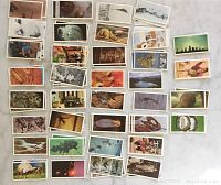 Overview of all collector cards showing various images related to unexplained mysteries and curiosities.