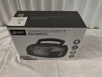 Front of sealed original box showing GPX CD/Radio/Cassette Boombox with image and feature icons
