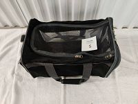 Good 2 Go basic pet carrier, black soft-sided with mesh top and front, two gray handles with padded grip. Shown in closed position laying on its side.