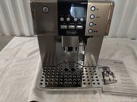 Front view of DeLonghi Gran Dama machine showing control panel, drip tray and steam wand