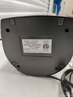 Bottom label of the heater showing model information and electrical specifications.