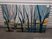 Full view of the large rectangular painting showing leafless trees with a layered colored background.