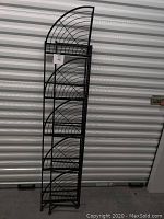 Photo of the corner shelf folded, showing the side profile and wire design.