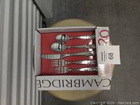 20-piece Cambridge Tula Mirror flatware set in original box showing all utensils from above.