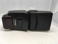 Top and side view of Canon Speedlite 420EX flash showing branding and flash head.