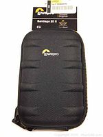 Front view of black Lowepro Santiago 20 II camera case showing textured protective form shell and attached packaging label.