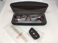 Bolle Laval eyeglasses in hard case with parts and cleaning cloth visible