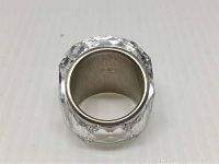 Close-up photo of the inside of the ring showing the stainless steel band and Swarovski stamp.