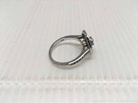 Side view of Swarovski ring showing size mark 52 and rose gold tone plating.