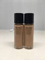 Front view of two bottles of Shiseido Synchro Skin Lasting Liquid Foundation Rose 3 showing product name and size.