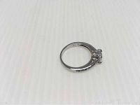 Side view of Swarovski rhodium plated ring showing band width and setting