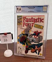 Front view of Fantastic Four #348 comic book graded CGC 9.6 in protective case, showing cover art with characters The Thing, Spider-Man, and others.