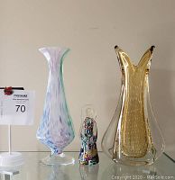Photo showing front view of two vases and one angel figurine with Murano tags visible confirming authenticity
