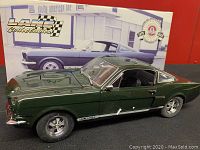 Model car displayed with original box in background