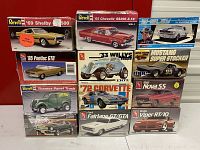 Twelve model kit boxes arranged in grid showing front artwork and titles