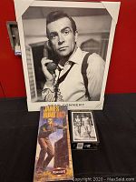 Overview showing framed photo, model kit and film still prints