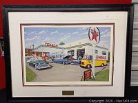 Framed print showing Texaco gas station scene with vintage cars and service van.