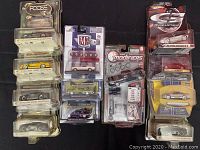 Full lot of packaged die-cast metal cars including various Ford Mustang models, Modifiers, and M2 Machines brands.