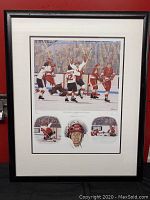 Full view of framed hockey print against red background