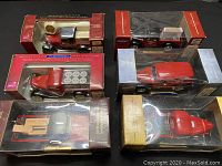 Six boxed die-cast pickup and delivery truck models arranged in two rows of three.