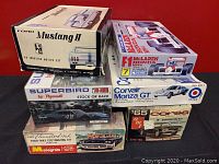 Stack of six plastic car model kit boxes