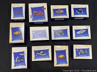 Photo showing 11 Hallmark Keepsake Collector's Series boxes with clear labels and aging packaging.
