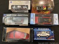Lot of six die cast metal car replicas in original packaging, including Ford Sierra, Shelby GT350, Ford Pickup, and others.