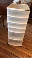 Front view of Sterilite plastic storage tote with five drawers showing overall condition and size.