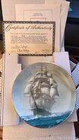 Collector plate in original box with Certificate of Authenticity showing detailed ship artwork and signature.