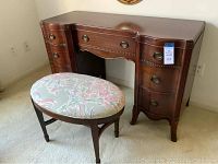 Photo of the vintage double pedestal desk and matching stool showing overall furniture design and condition