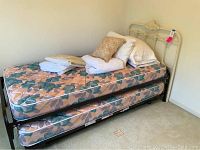 Full assembled trundle bed with both mattresses installed