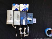 Photo showing two Shimano Deore XT rear hubs and two Shimano Deore LX front hubs with quick release skewers, alongside two boxes of Torque Tube inner tubes.