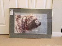 Frontal view of framed print showing bear profile, mats and frame