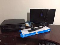 Lot with Epson Artisan 730 printer, Microsoft keyboard and mouse in box, Samsung 24-inch monitor, photo paper box