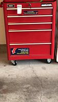 Front view of red Mastercraft 5-drawer tool chest with lock, key and caster wheels
