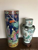 Both vases side by side on a wood surface