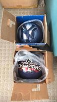 Two boxed New York Yankees bowling balls, one with the Yankees logo and the other with 2009 World Series Champions design