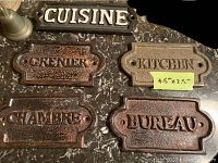 Set of 5 cast iron plaques with French and English room names including Cuisine, Grenier, Chambre, Kitchen, Bureau.