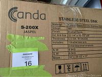 Box front label showing brand, model, material, finish, dimensions and included components