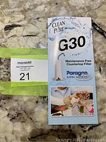 Boxed Paragon G30 Clean Pure maintenance free countertop water filter with instructions shown on box.