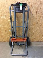 Folded upright position showing frame and wheels