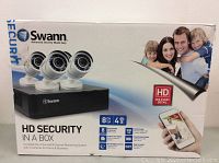 Front of retail box showing DVR and three cameras with family image