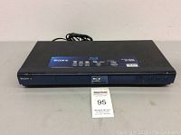 Front and top view of Sony BDP-S350 Blu-ray Disc Player showing brand and function labels.