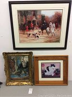Large framed print featuring a hunting scene with riders and beagles, accompanied by two smaller framed artworks beneath.