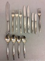 All cutlery pieces arranged in two rows