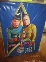 Blue T-shirt in packaging with Spock and Capt. Kirk portrait and ‘Tour 2004’ text