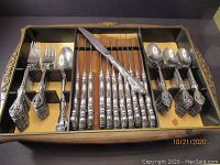 Overview of full flatware set arranged in storage case showing all pieces.