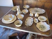 Group shot showing all serv­ing pieces and candlesticks
